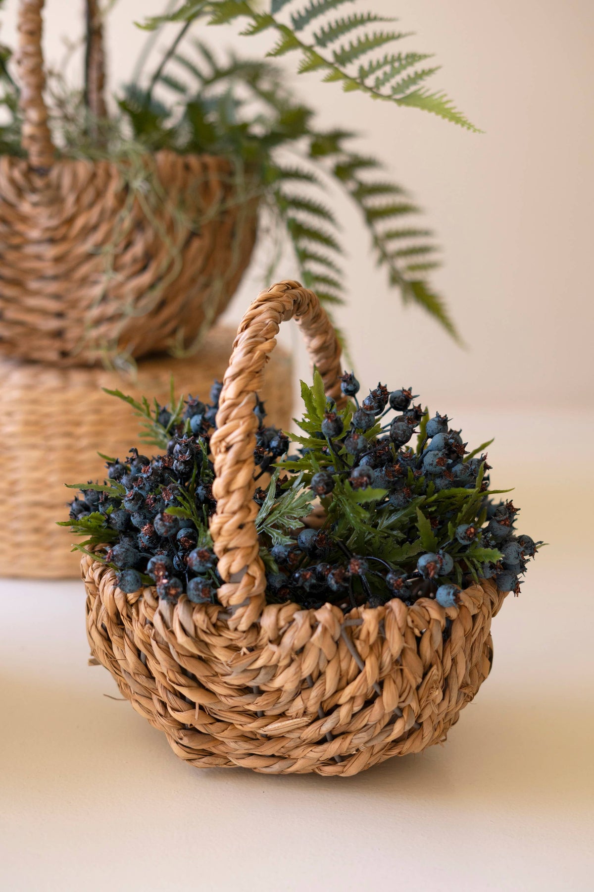 SET OF THREE WOVEN SEAGRASS BASKETS WITH HANDLES